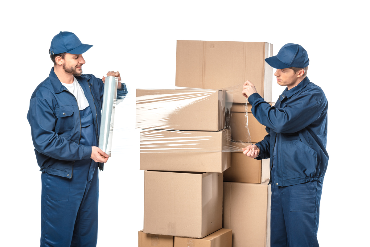 two movers using stretch wrap to wrap around boxes