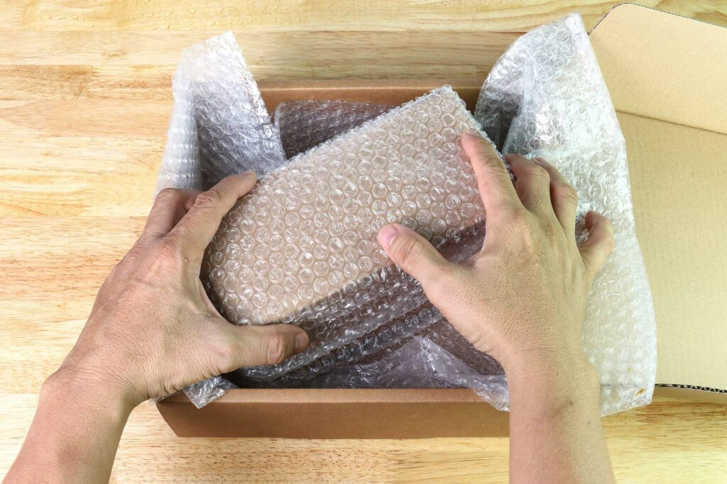 bubble wrapping a fragile box