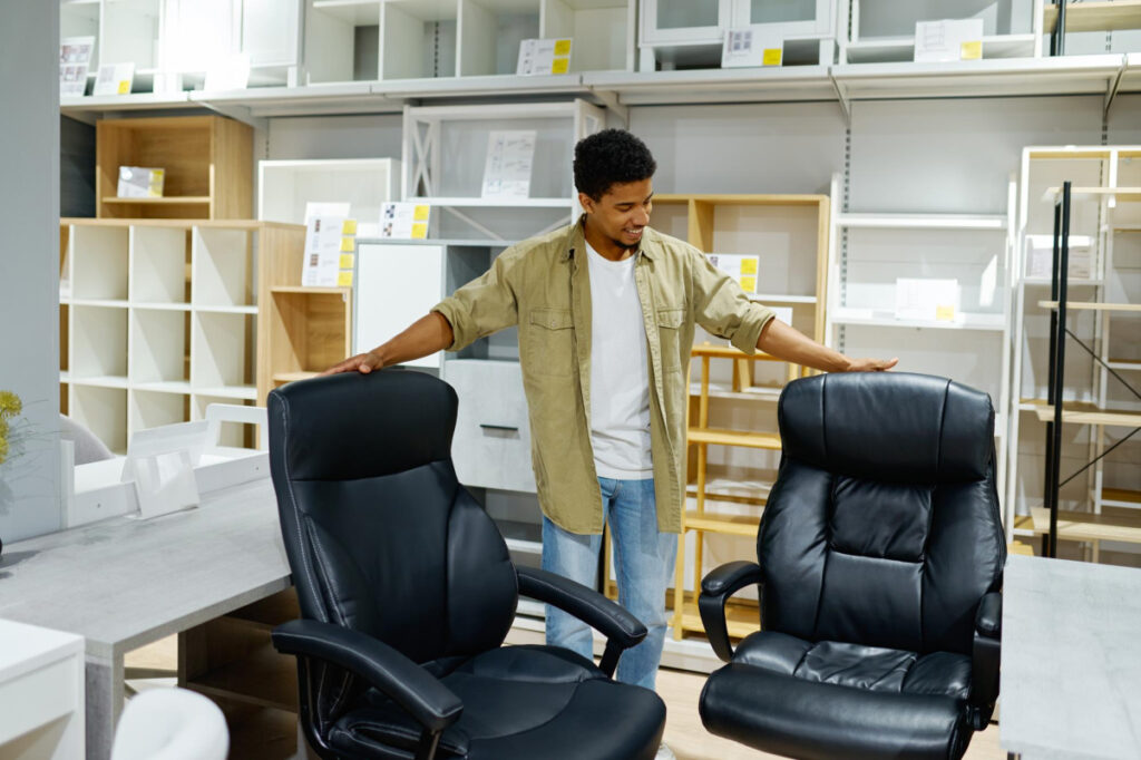 man choosing office chairs for his business