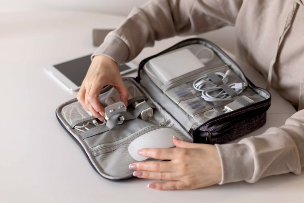 woman packing electronic gadget